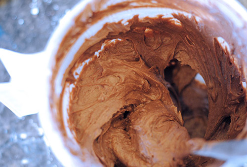 Making chocolate frosting for Harry Potter Cauldron Cakes.