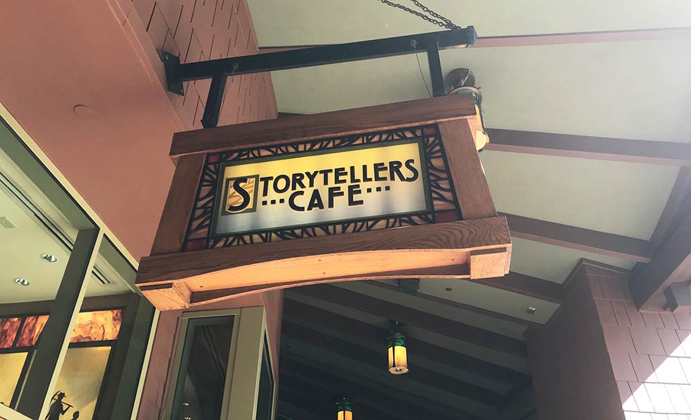 Things to Know About Character Dining Storytellers Cafe Sign