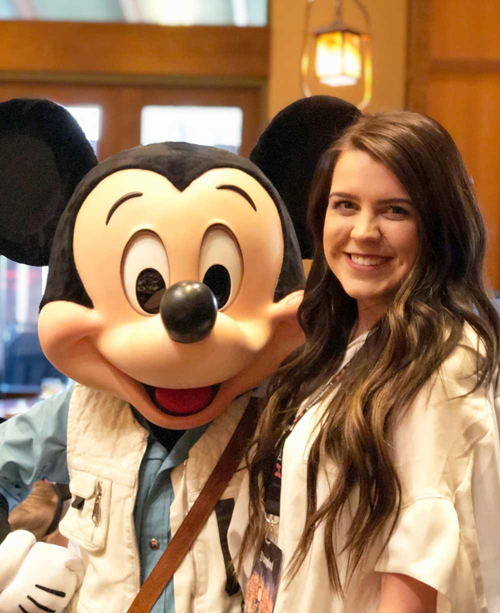 Tips for a great Disneyland Vacation Character Dining girl with Mickey Mouse