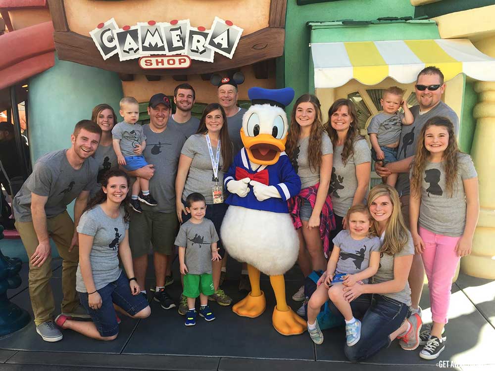 Family with matching gray shirts at Disneyland