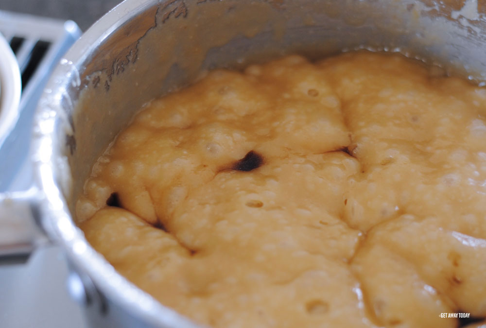 Vanilla added to bubbling ingredients in pot