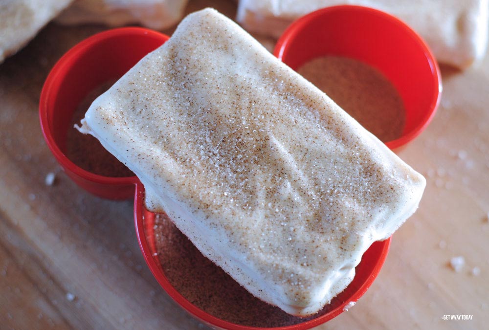 finished Disney churro toffee on red Mickey bowl