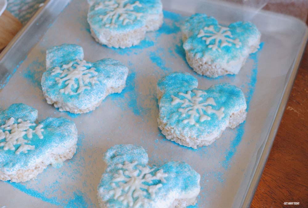 tray of frozen treats with covered in blue sugar sprinkles