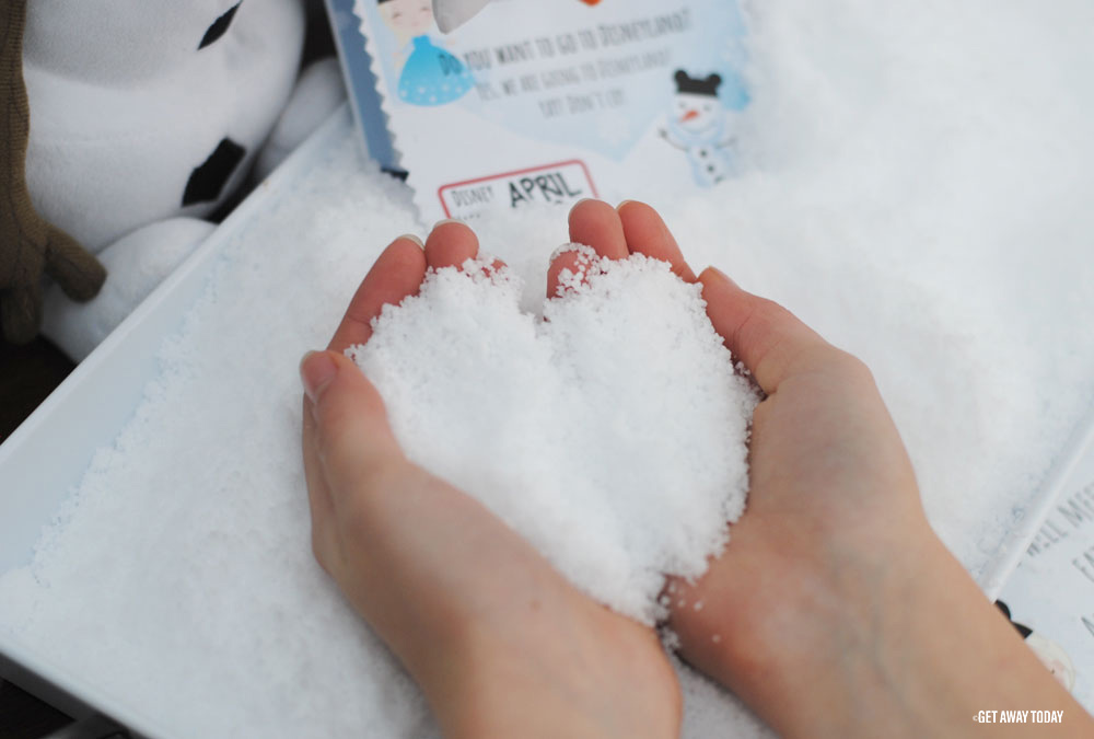 fluffy snow in hands
