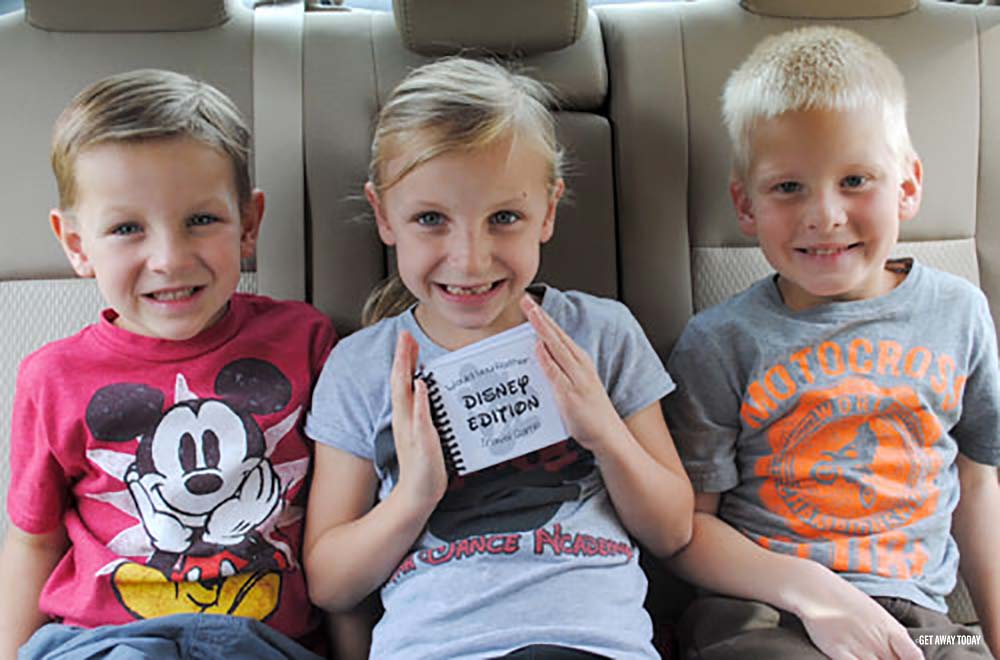 Kids in car for road trip with Disney game