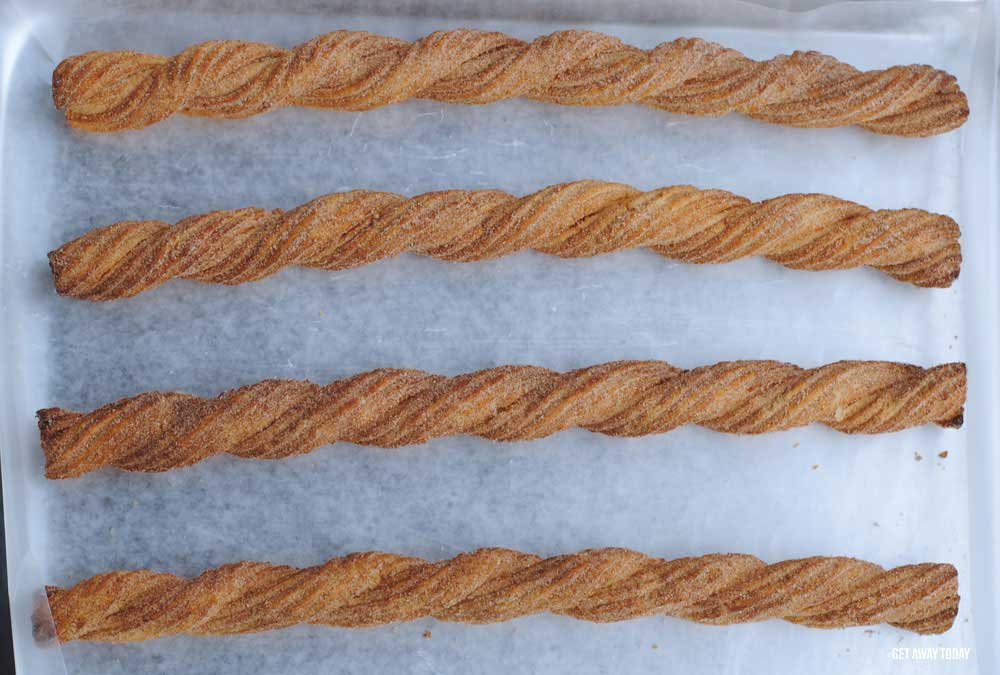 plain churros on a tray