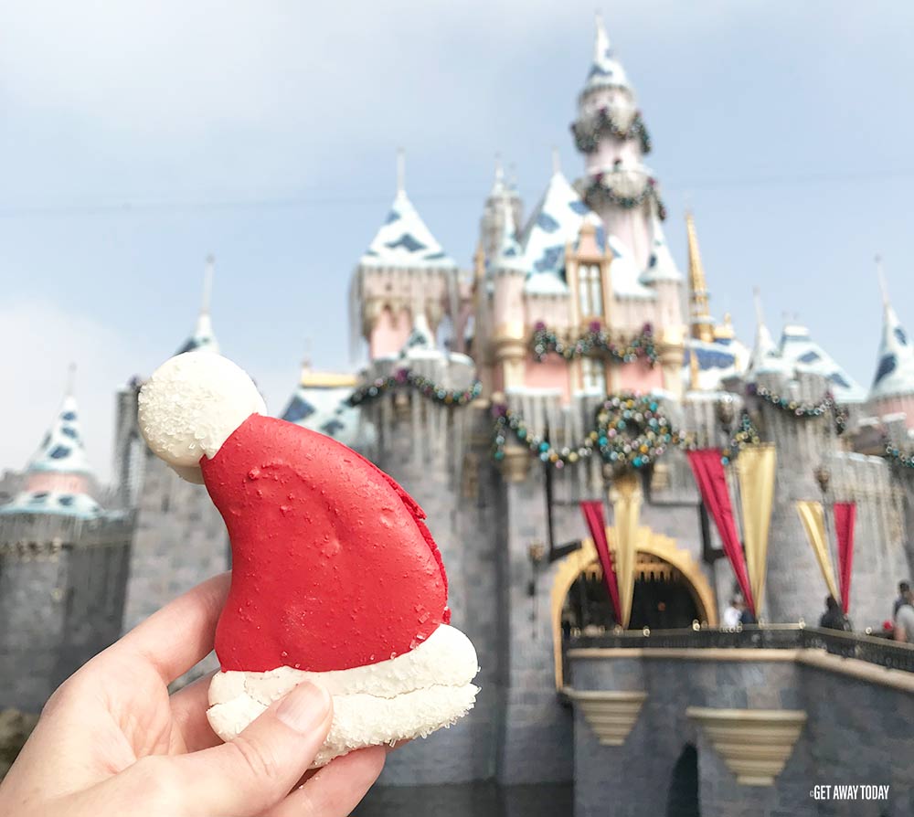 Santa Hat Macaron in front of the Disneyland Castle