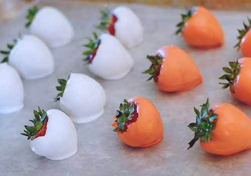 Dipped Jack Skellington chocolate covered strawberries setting up