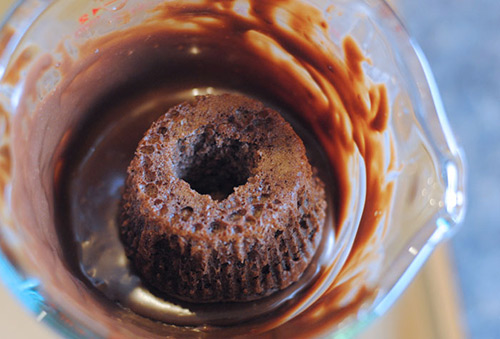 Dipping the bottom of Harry Potter Cauldron Cakes into melted chocolate.