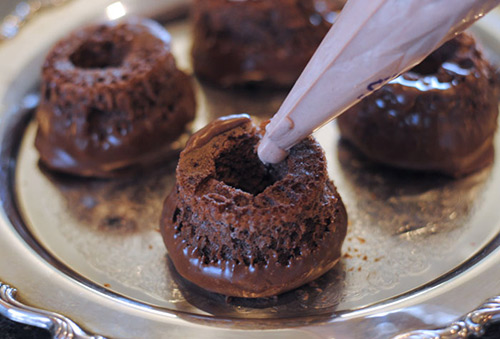 Adding filling to Harry Potter Cauldron Cakes.