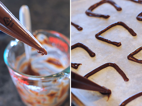 Making the handles for Harry Potter Cauldron Cakes by piping chocolate.