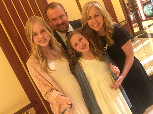 Family dressed up on surprise cruise